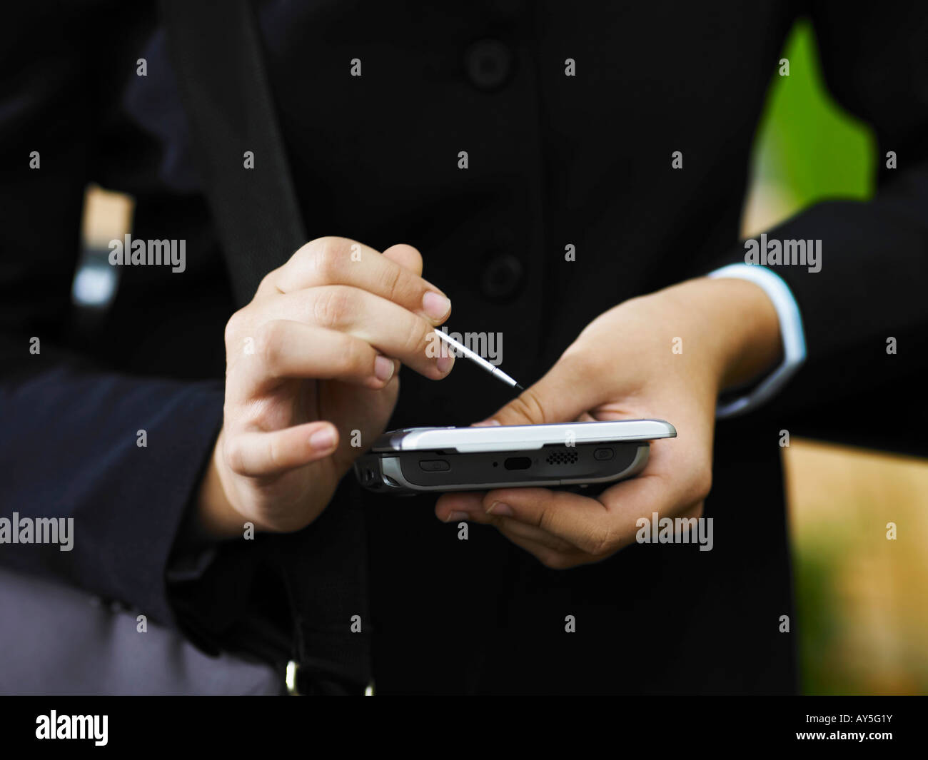 Pair of hand holding a PDA Stock Photo Alamy