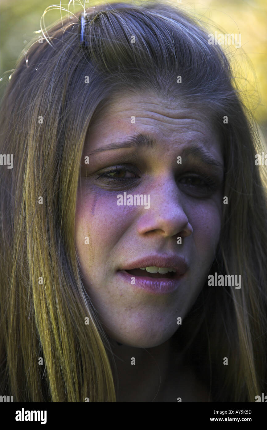 Young girl looking very upset and tearful Stock Photo