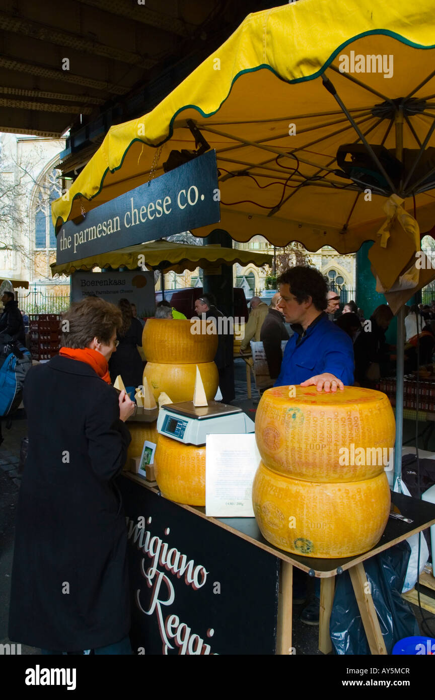 Stall selling Parmesan cheese at Borough Market in London UK Stock Photo