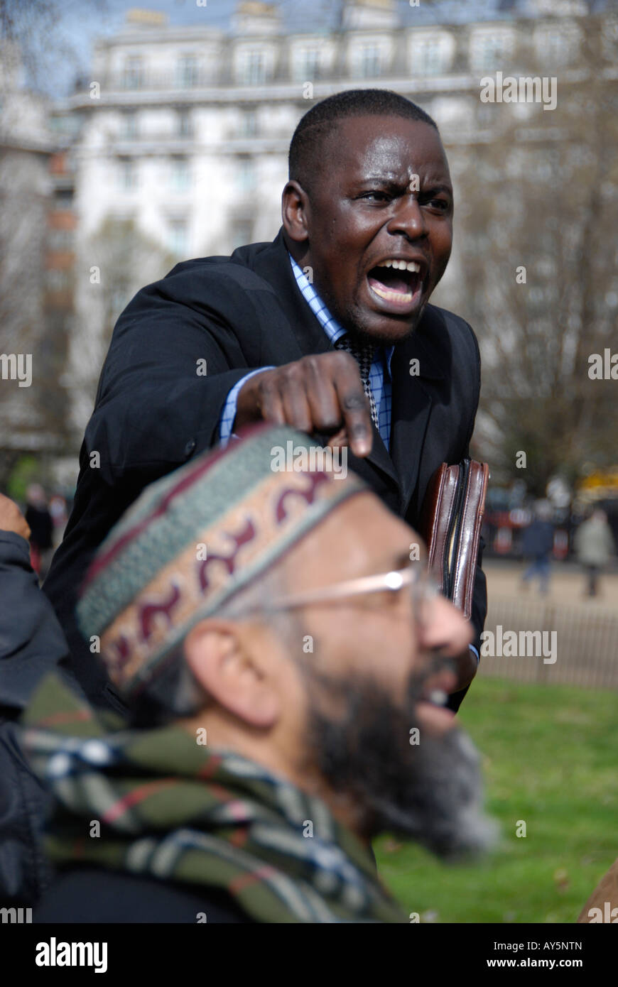 Evangelical Christian preacher shouting at Muslim at Speaker s Corner London Stock Photo