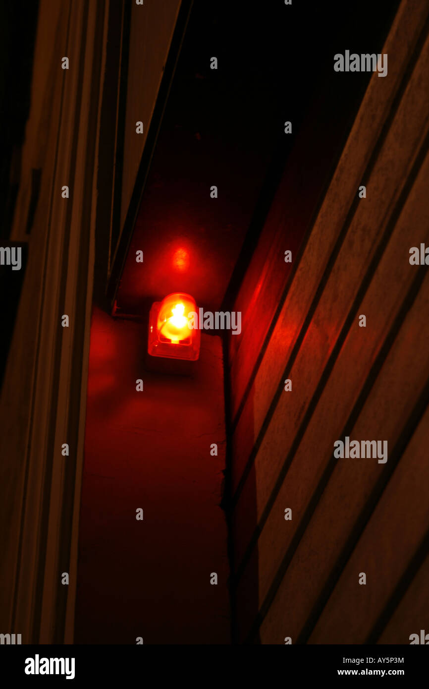red security light alarm on wall Stock Photo Alamy