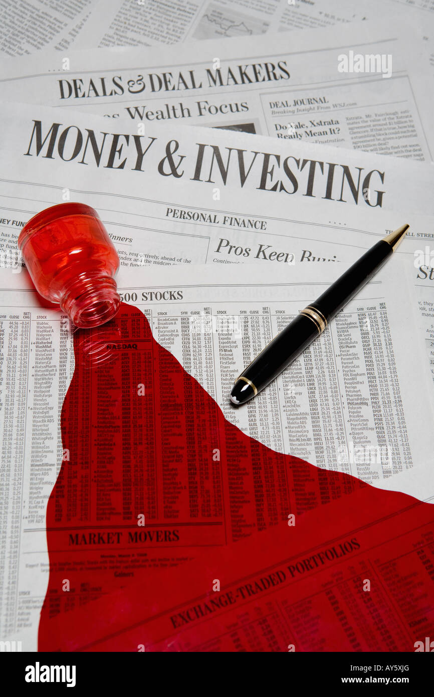 red ink spilled on business section of newspaper Stock Photo Alamy
