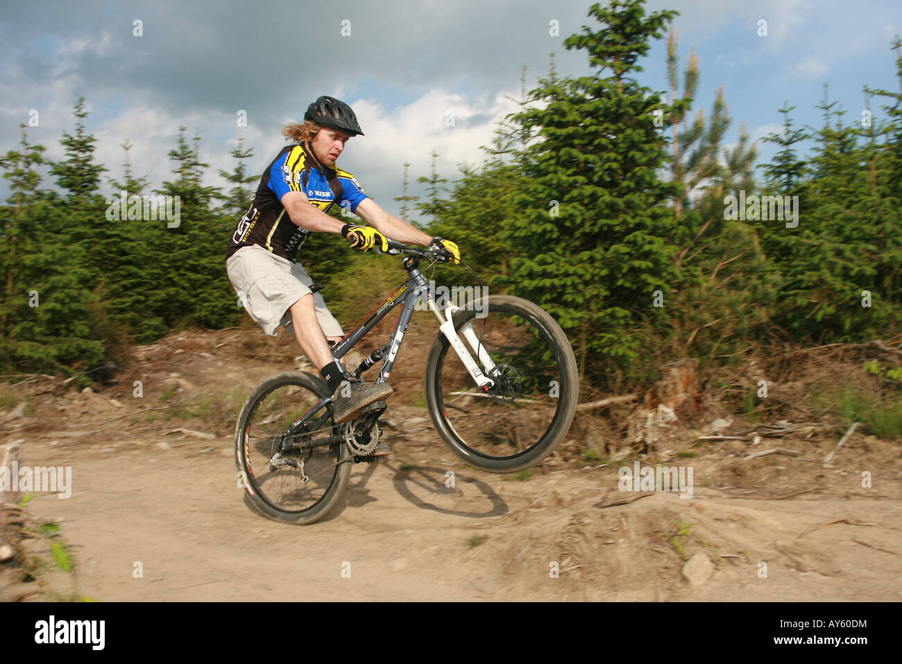 Mountain biker wheelies mountain bike hires stock photography and