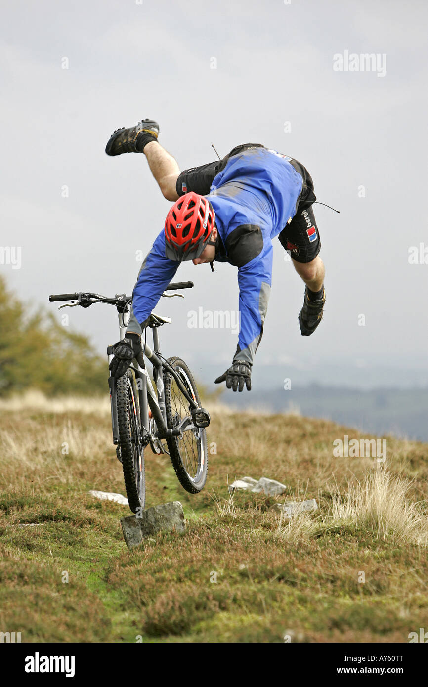 A mountain biker crashing with his mountain bike Stock Photo Alamy