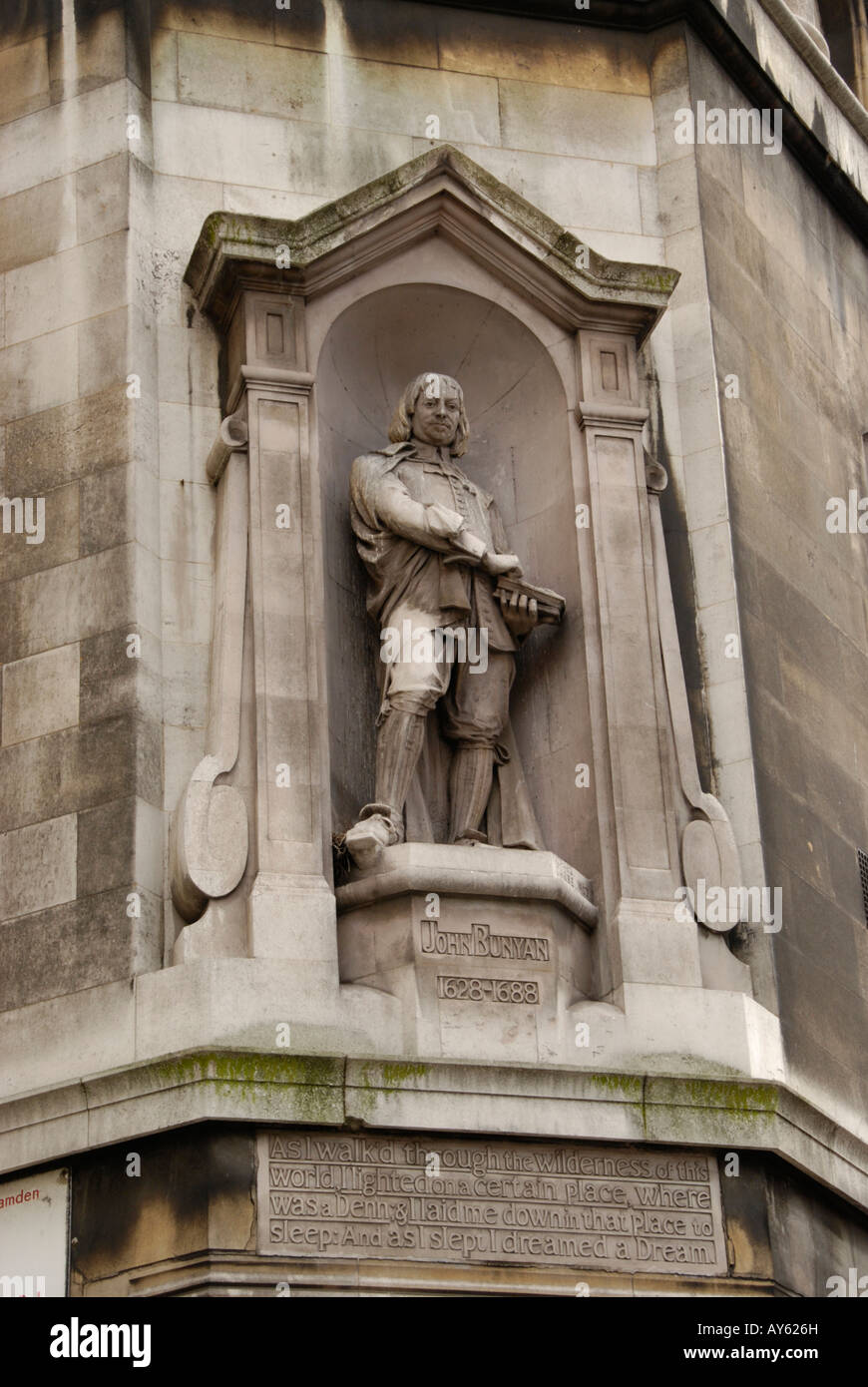 Statue of John Bunyan on exterior of building in Southampton Row London Stock Photo