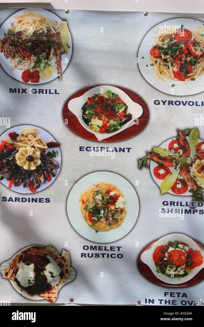 Greek menu with pictures of food at a Greek restaurant. Crete, Greece