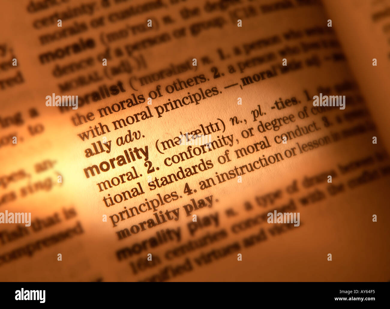 CLOSE UP OF DICTIONARY PAGE SHOWING DEFINITION OF THE WORD MORALITY Stock Photo