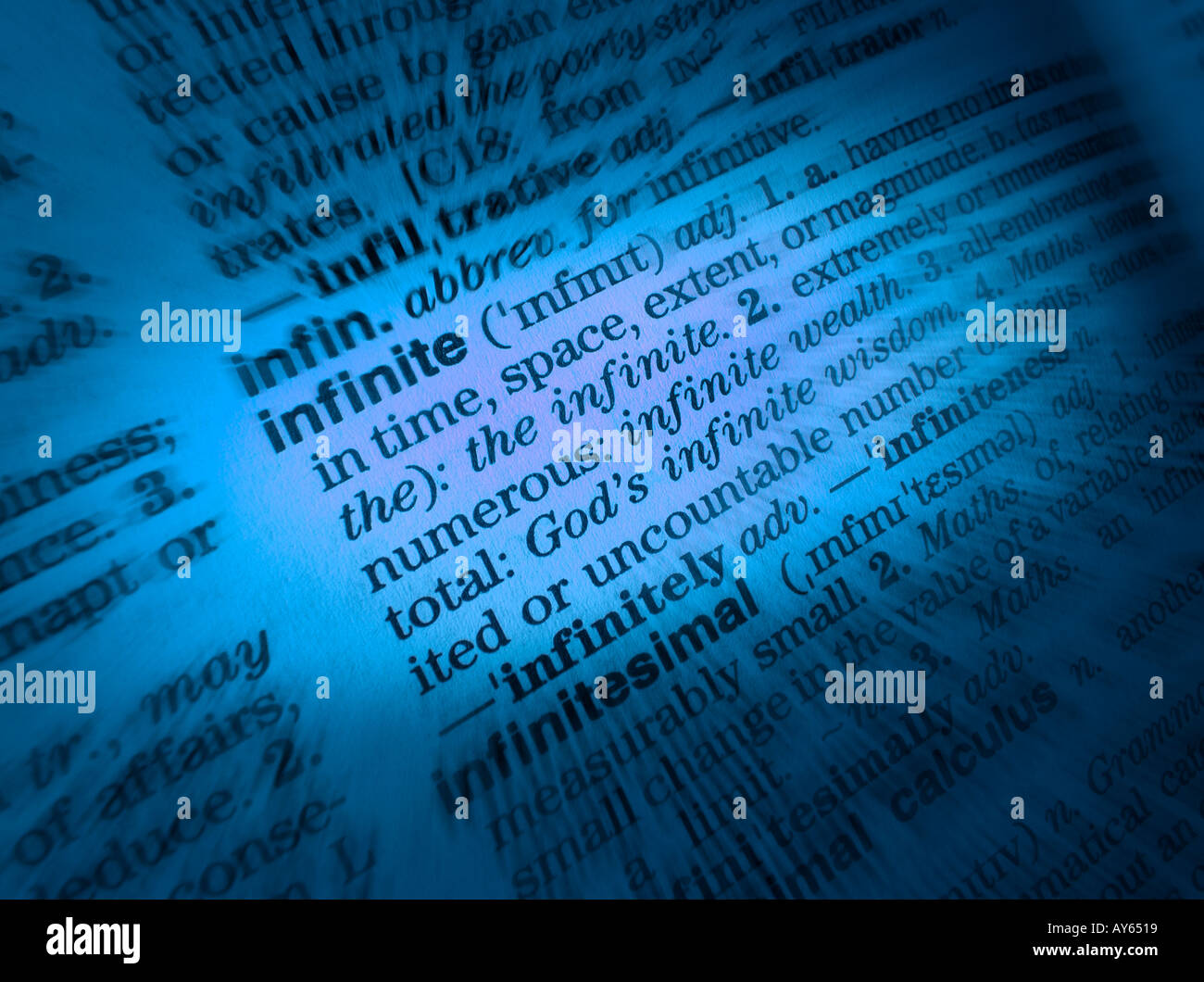 CLOSE UP OF DICTIONARY PAGE SHOWING DEFINITION OF THE WORD INFINITE Stock Photo