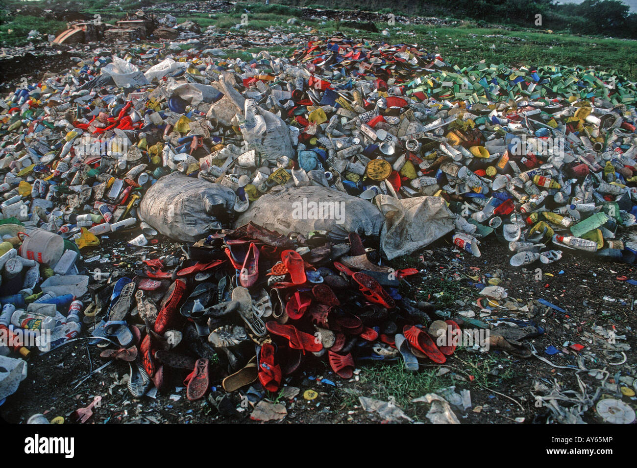 Plastic containers dumped in open landfill site UK Stock Photo Alamy