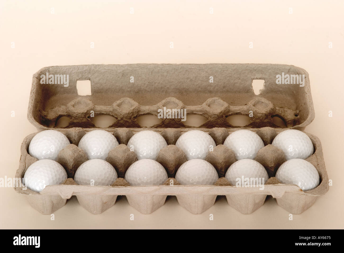 golf balls in egg carton Stock Photo - Alamy