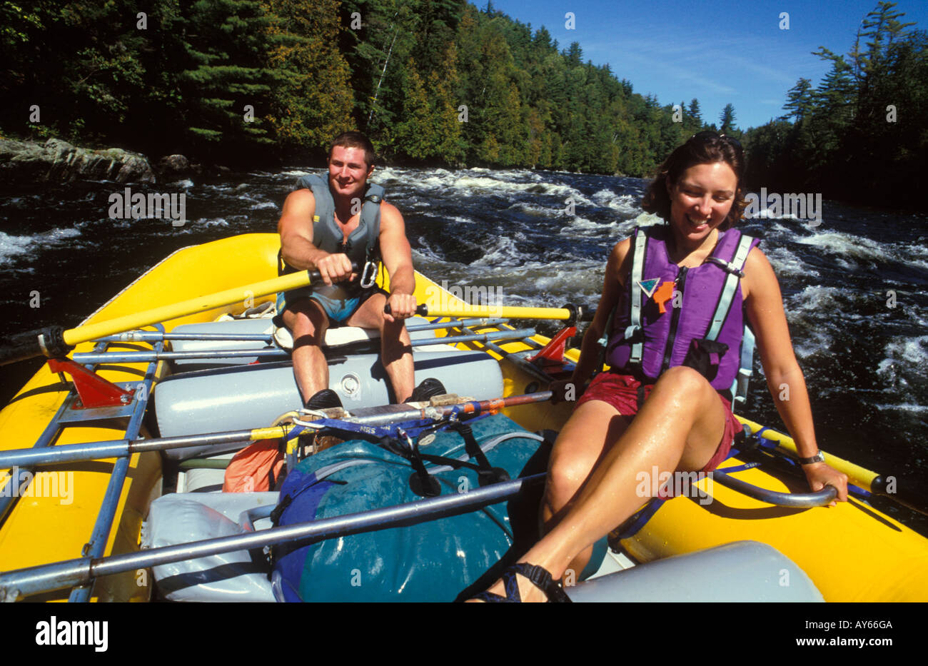 Couple riding a row frame on the Kennebec River Maine USA Stock Photo