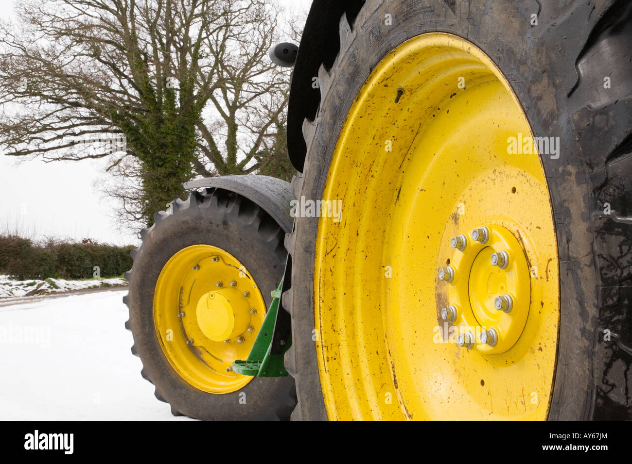 A close up low level angle of tractor wheels in snow Stock Photo Alamy