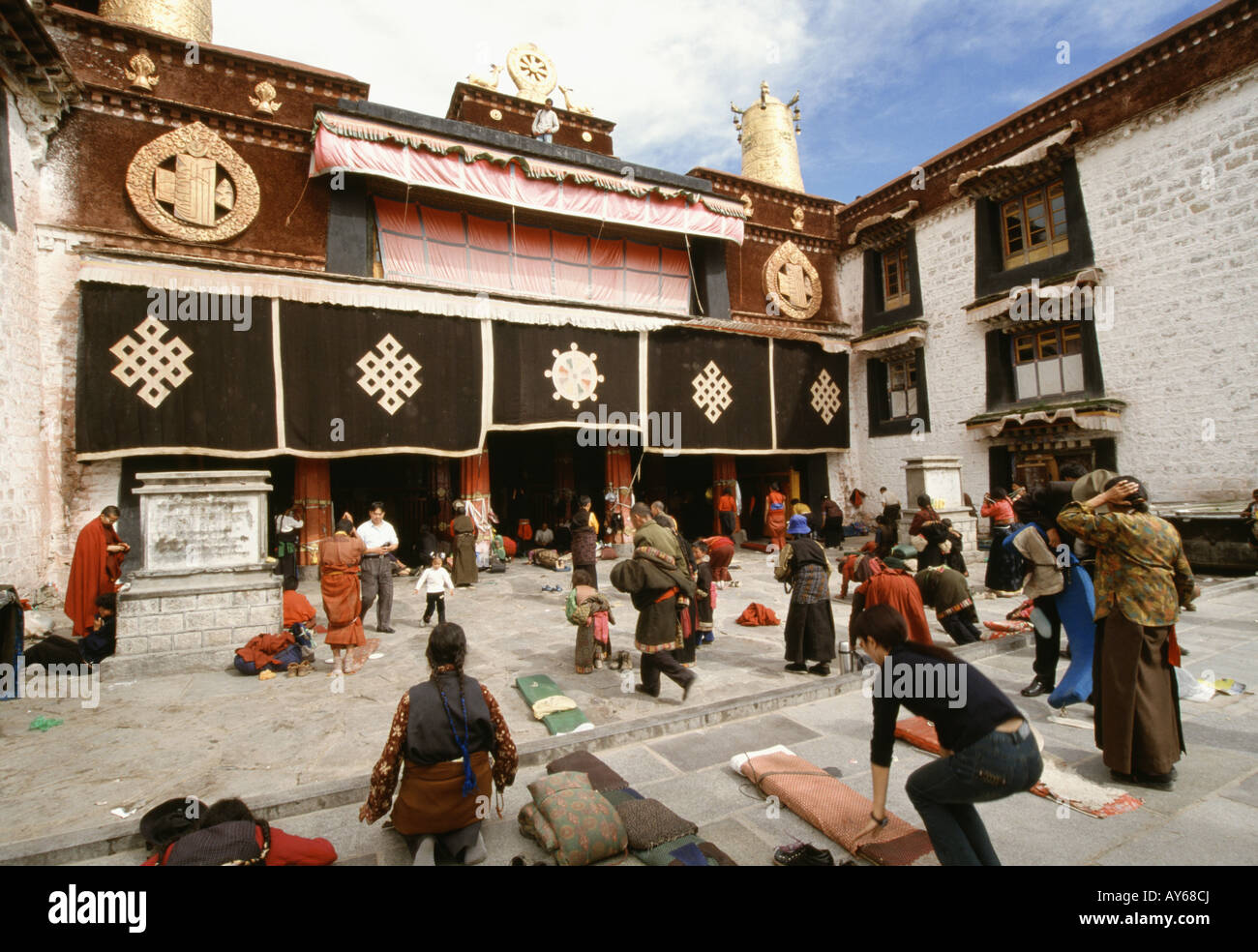 Jokhang Cathedral In Barkhor Square People Praying Prayer Mats