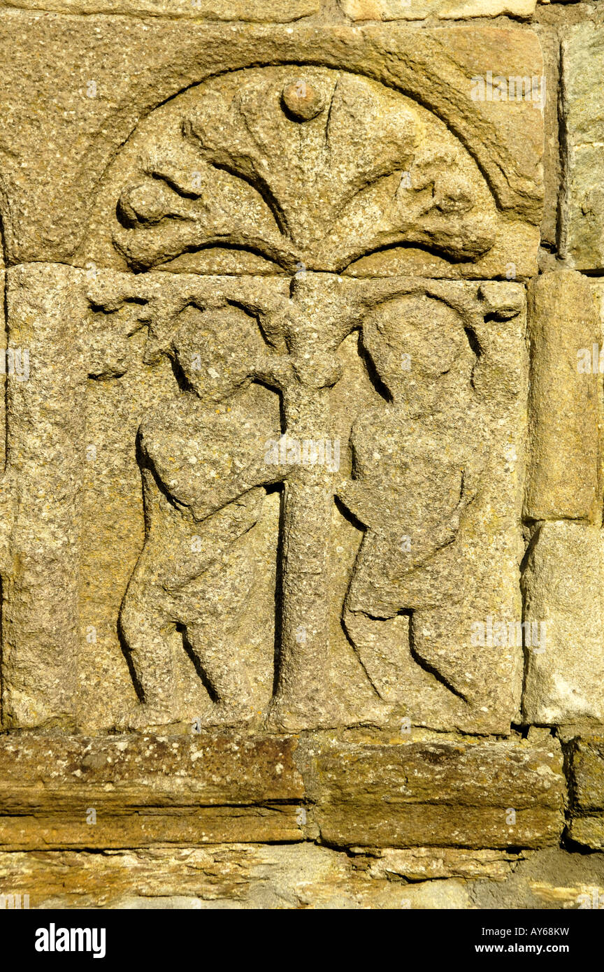 Carving of Adam and Eve on the West Gable of St Declans Cathedral Ardmore Co Waterford Ireland Stock Photo