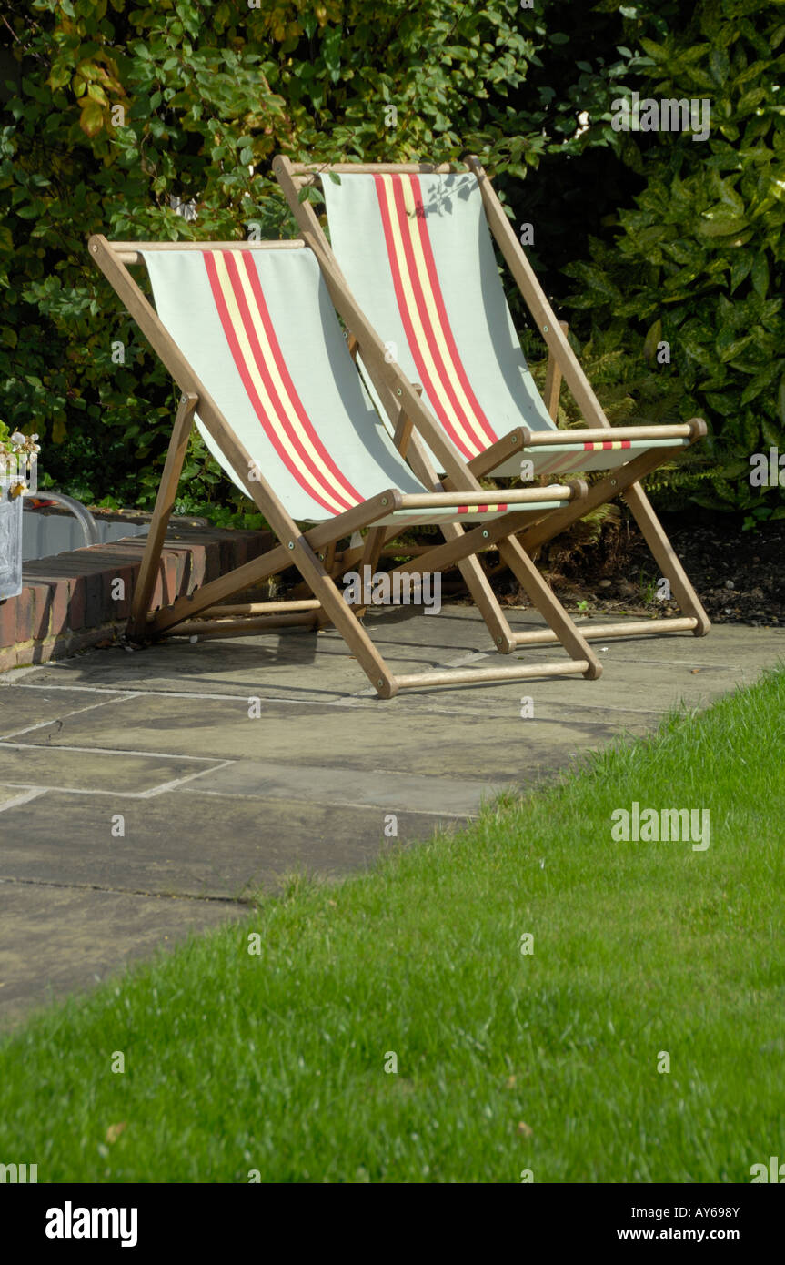 Two folding deck chairs in sun Stock Photo