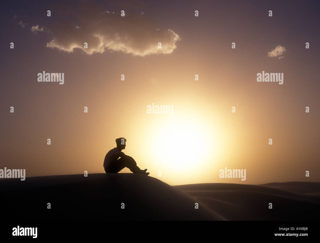 Tourist watches sunset at White Sands monument New Mexico USA Stock Photo