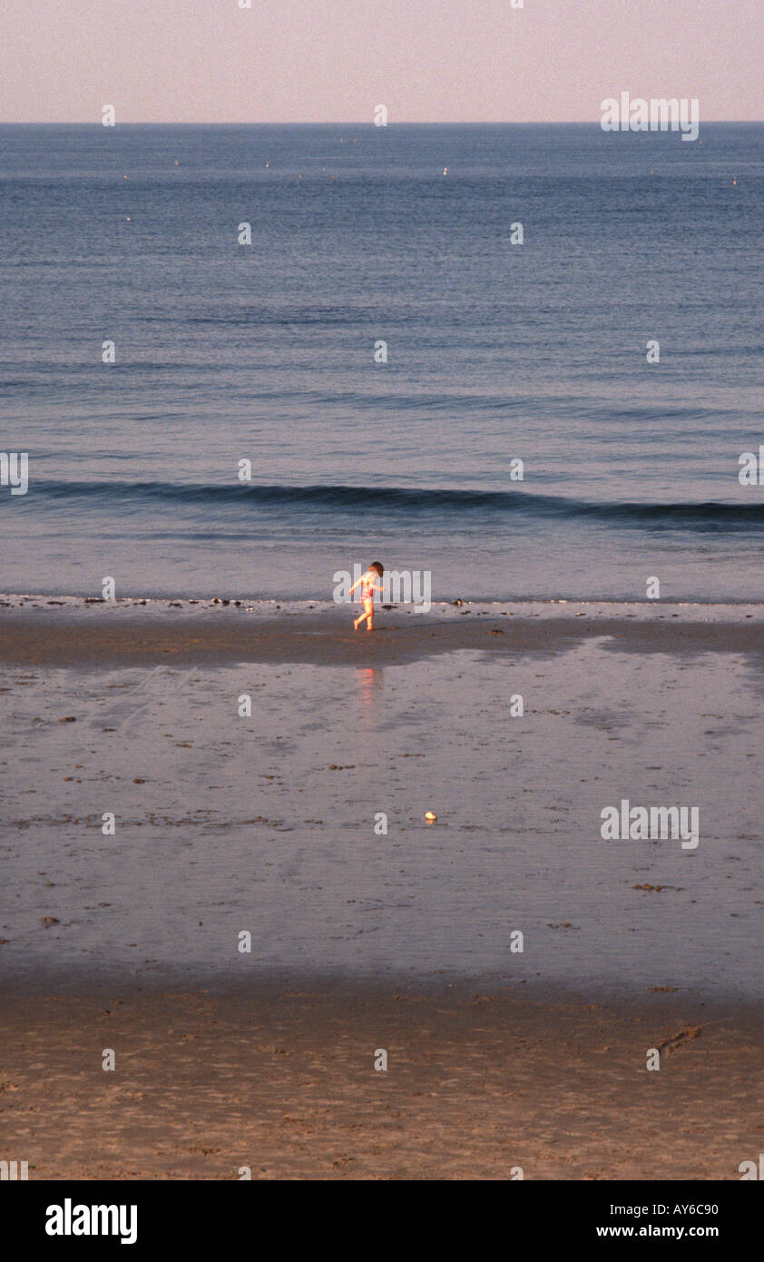A child plays in the tide on Hampton Beach New Hampshire United States