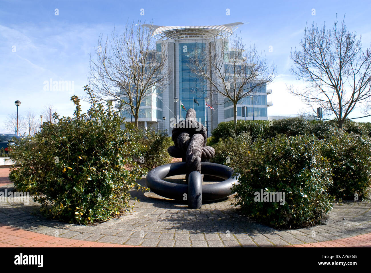 Sculpture of rope and St Davids Spa and hotel, Cardiff Bay, Cardiff, Wales. Stock Photo