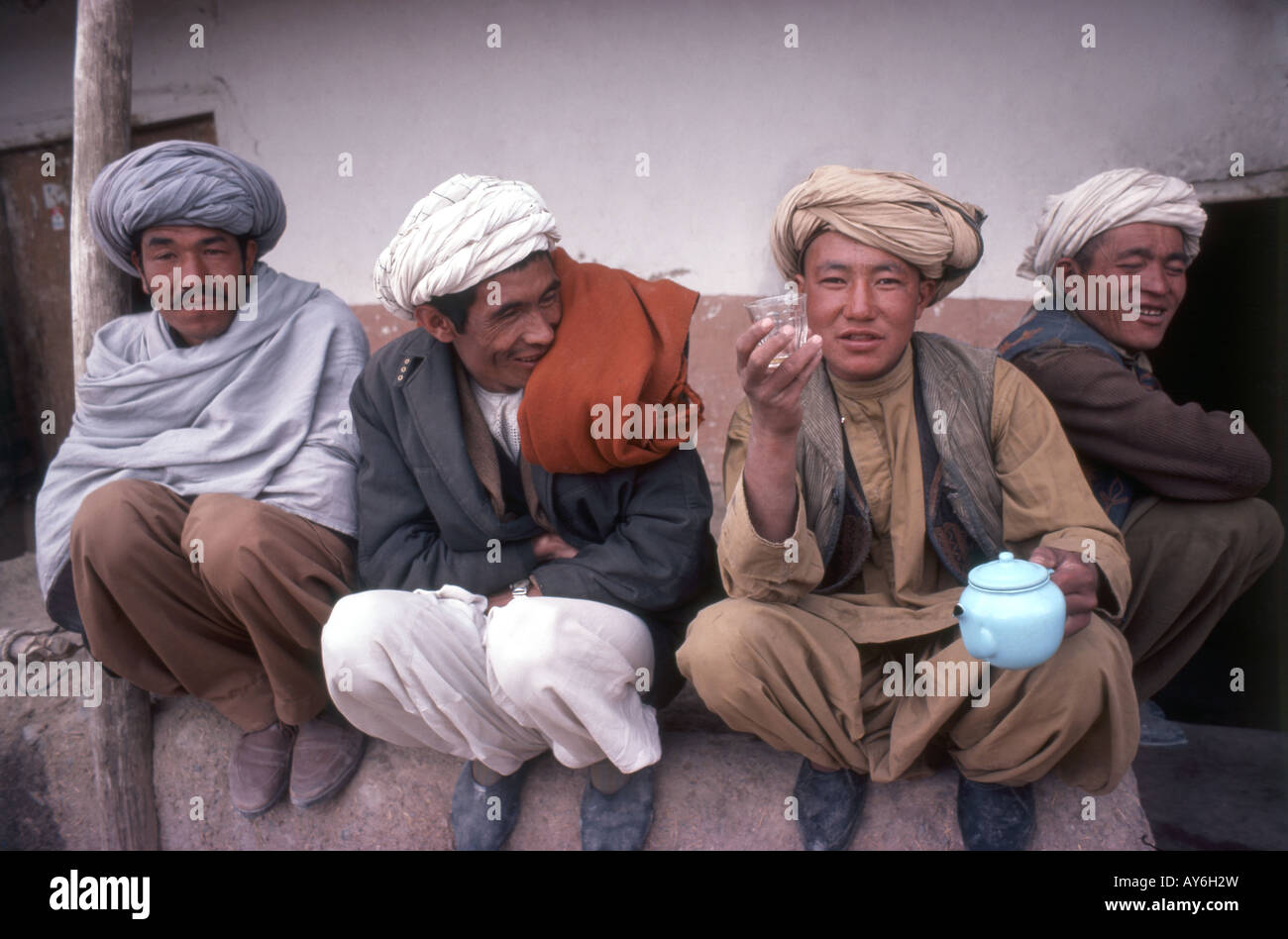 Local men sitting outside tea shop, Islamic Republic of Afghanistan Stock Photo