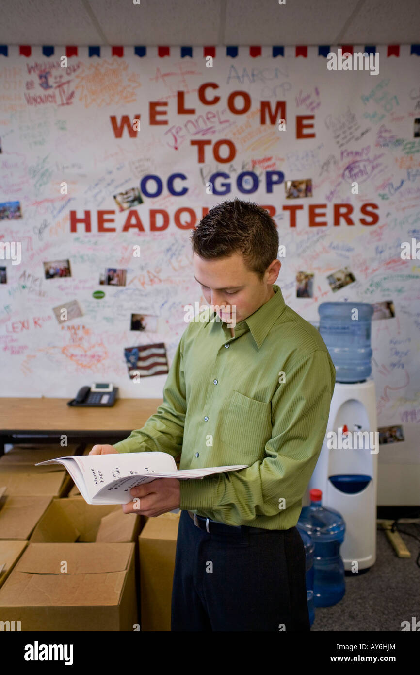 An office worker verifies mailing labels at Republican Party HQ in Orange California Note cartons of campaign literature Stock Photo