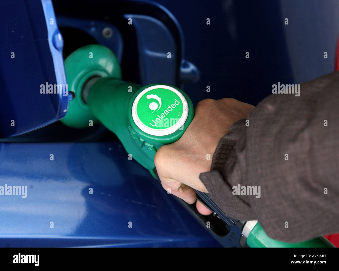 A man fills up his car at a petrol pump at an Esso service station in Essex Stock Photo Alamy