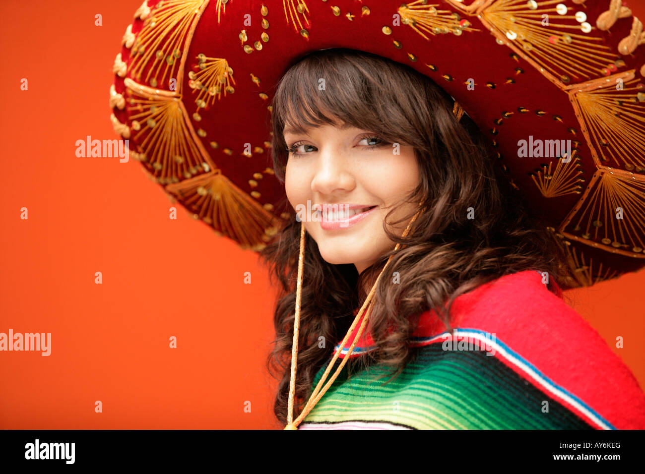 Mexican woman wearing traditional hat hi-res stock photography and