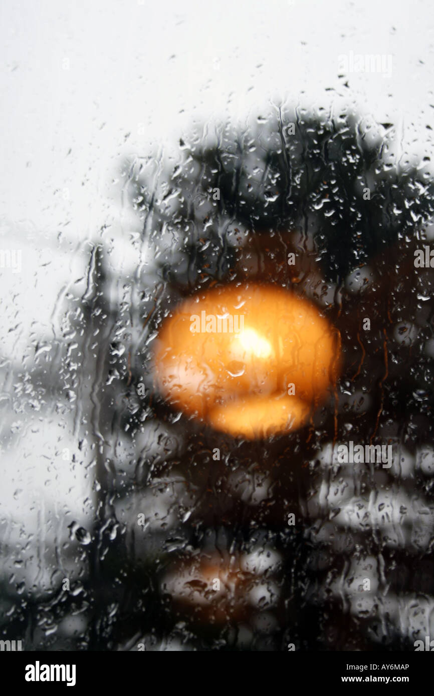 light fitting reflection on rainy window Stock Photo