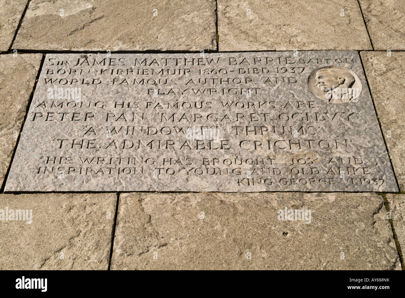 A plaque with Sir James Matthew Barrie engraved into stone slab Sculpted by Bruce Walker in Kirriemuir UK Stock Photo