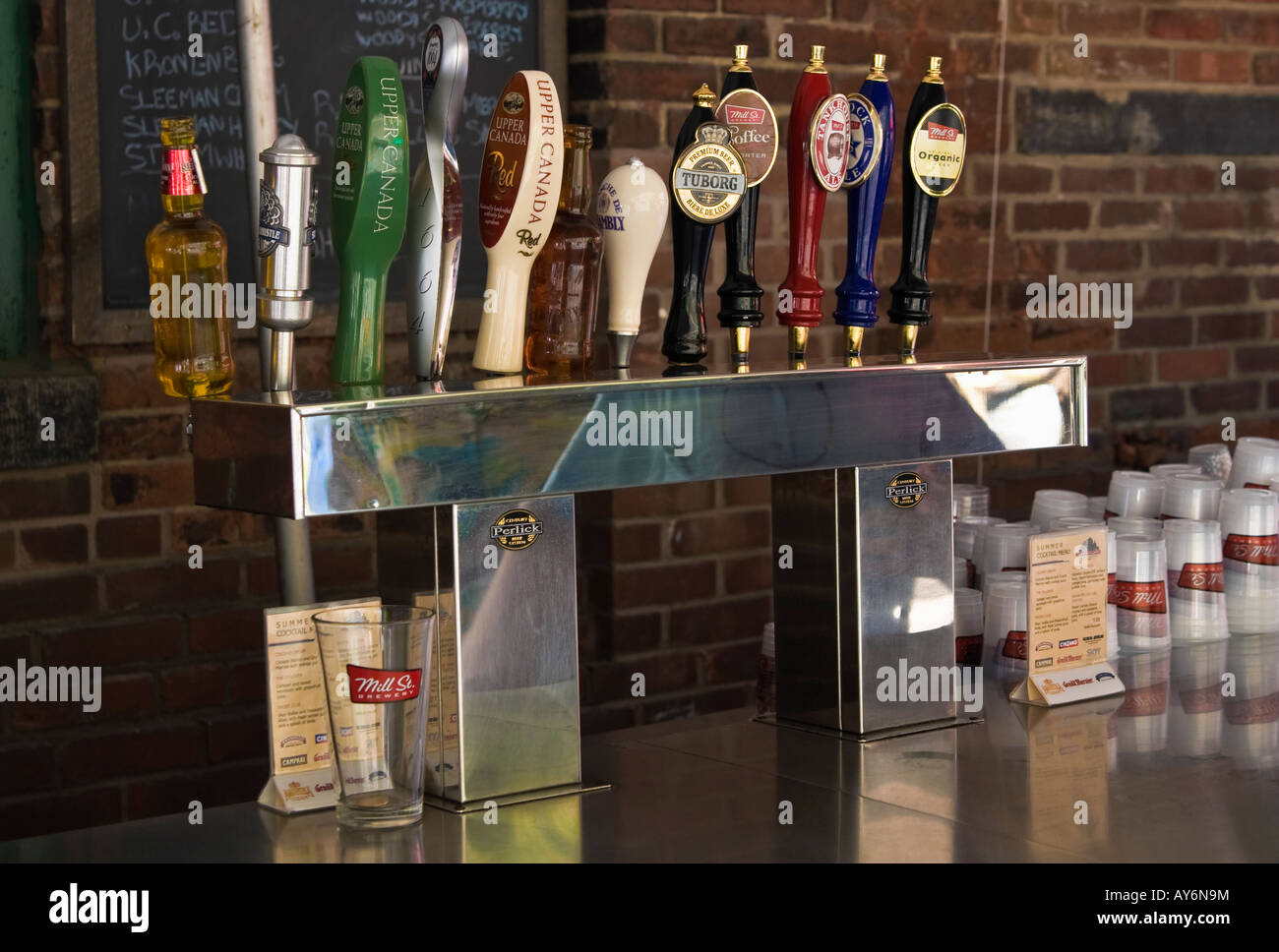 Bar taps with predominantly Canadian beer brands; Distillery District bar-restaurant popular tourist destination Toronto Ontario Stock Photo