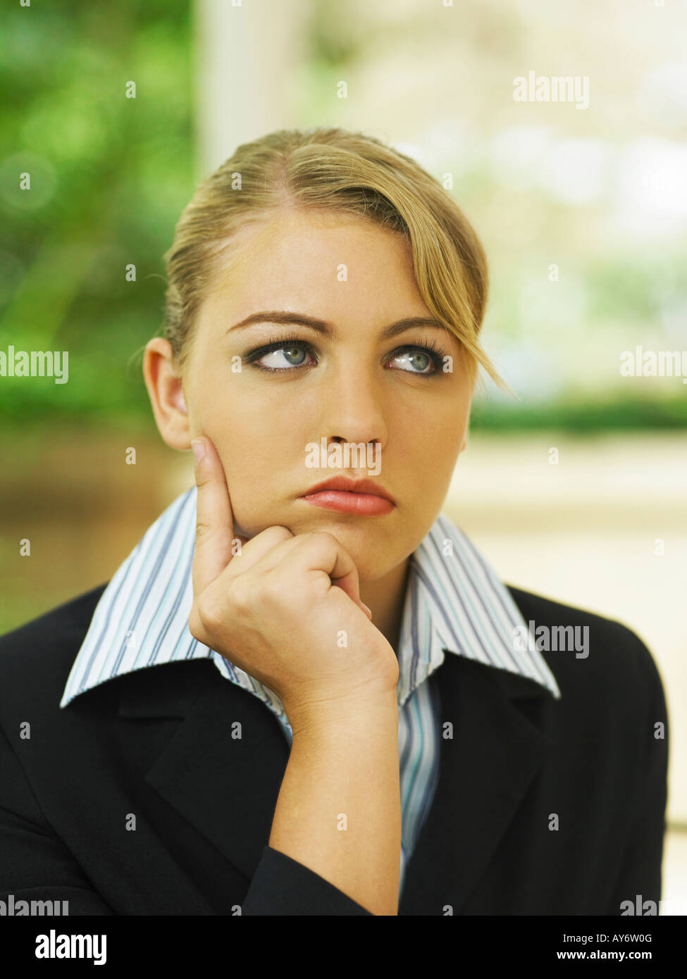 Close up of a businesswoman looking away Stock Photo - Alamy