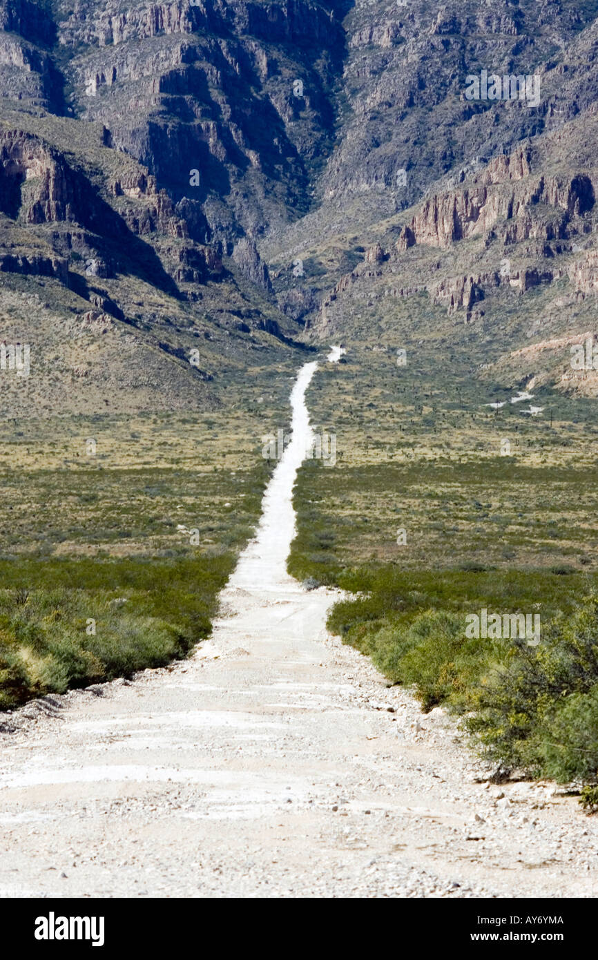 Ranch road in west texas near the Guadalupe Mountains National Park in the north tip of the Chihuahuan Desert Stock Photo