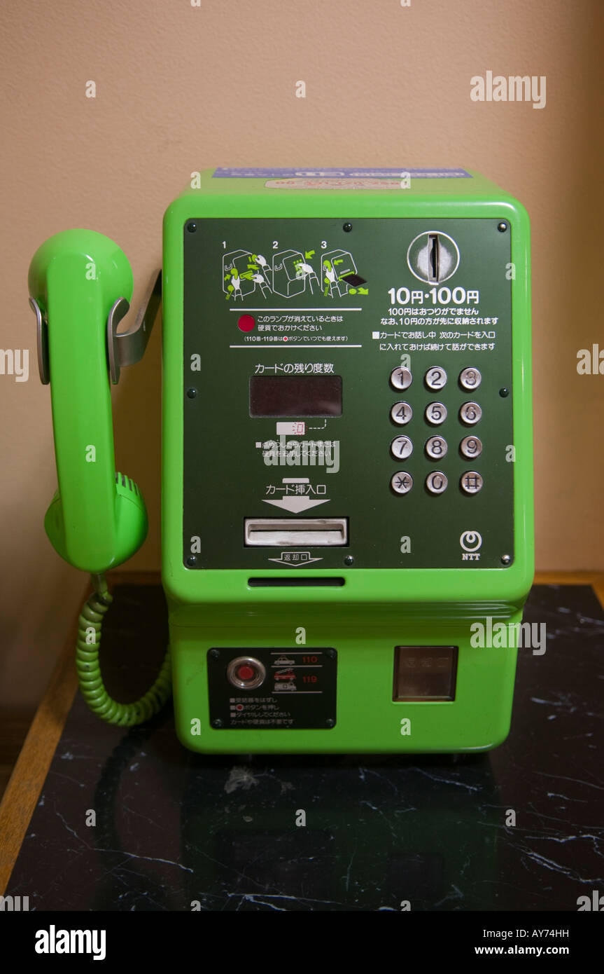 Green public telephone in Japan Stock Photo