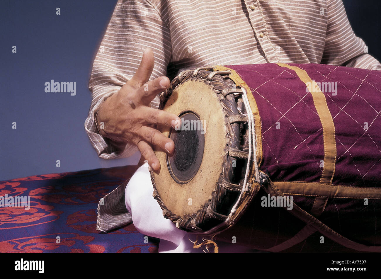 Indian classical music maestro T K Murthy playing with right hand percussion musical instrument Mridangam in concert India Stock Photo