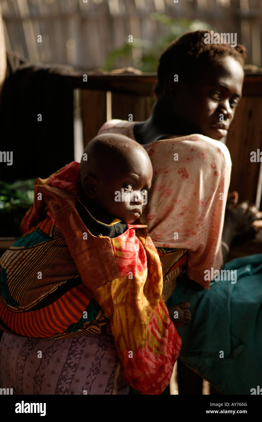 African woman with child baby in sling the Gambia West Africa Stock