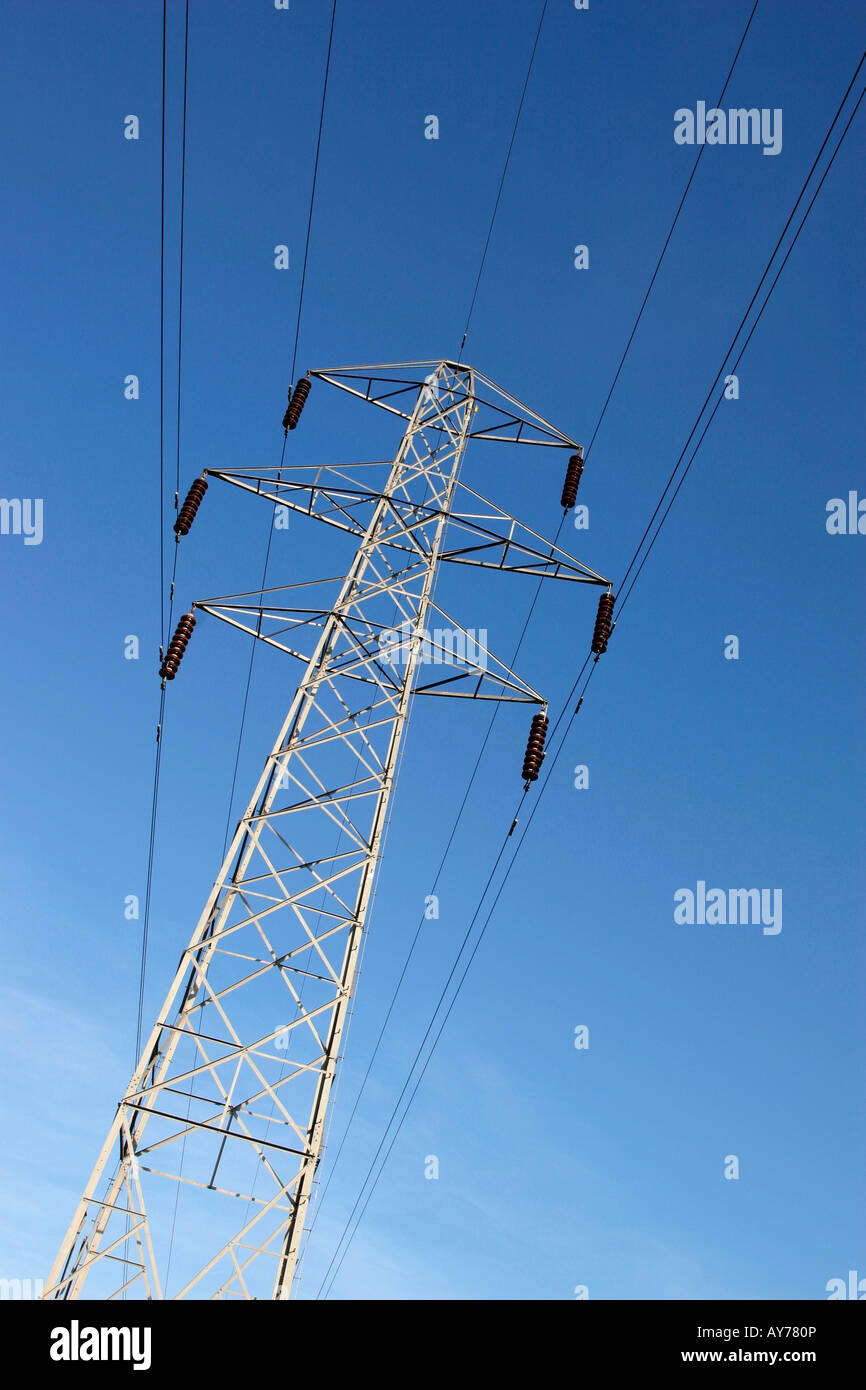 Electricity pylon against blue sky in the UK Stock Photo - Alamy