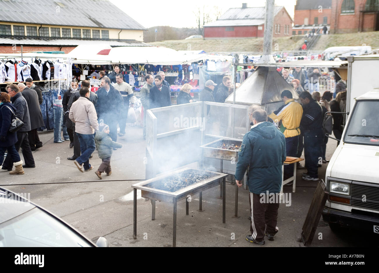 Barbecue kiosk in weekend flea market run by immigrants in former stables of old Kviberg regiment. Kviberg Gothenburg Sweden Stock Photo