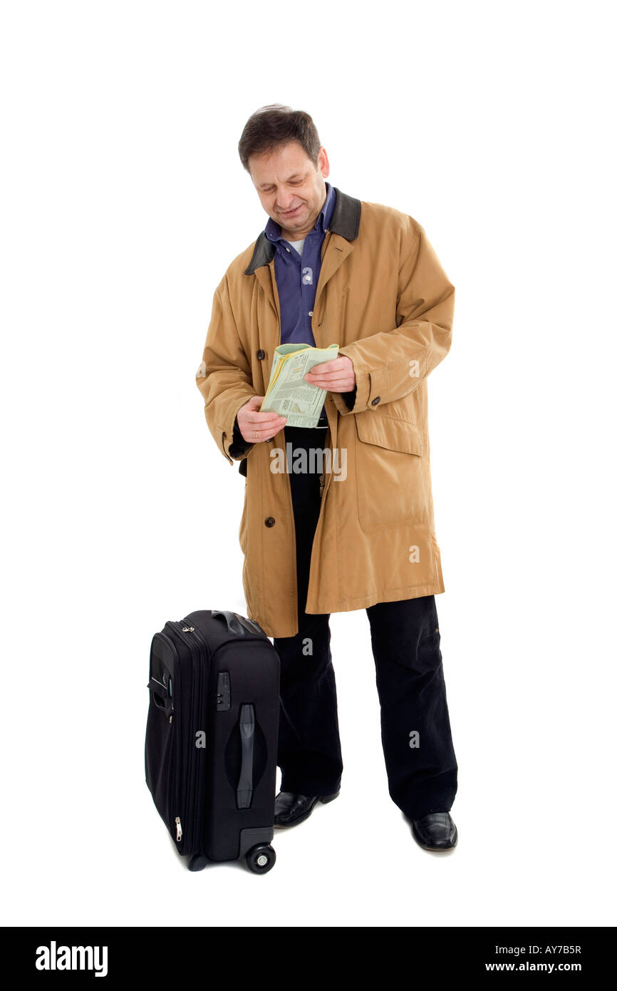 Man in brown jacket with black suitcase Stock Photo Alamy