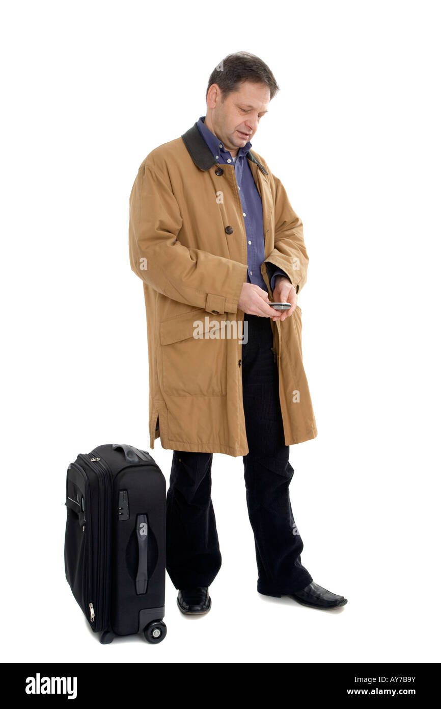 Man in brown jacket with black suitcase Stock Photo Alamy