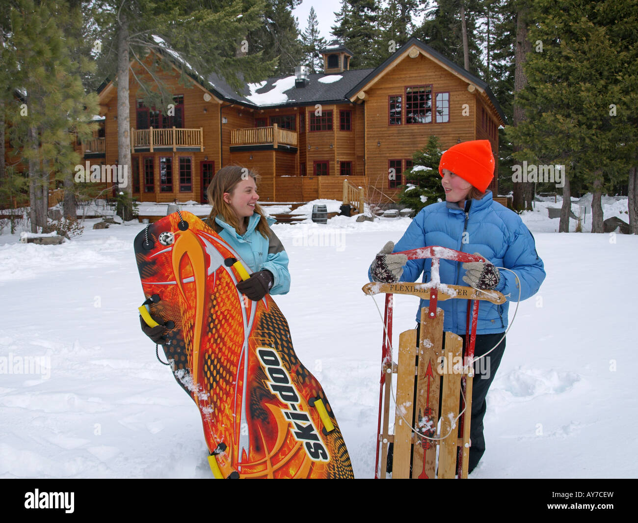 Two teenagers enjoy a fresh winter snow at Suttle Lake Resort in the Cascade Mountains Stock Photo
