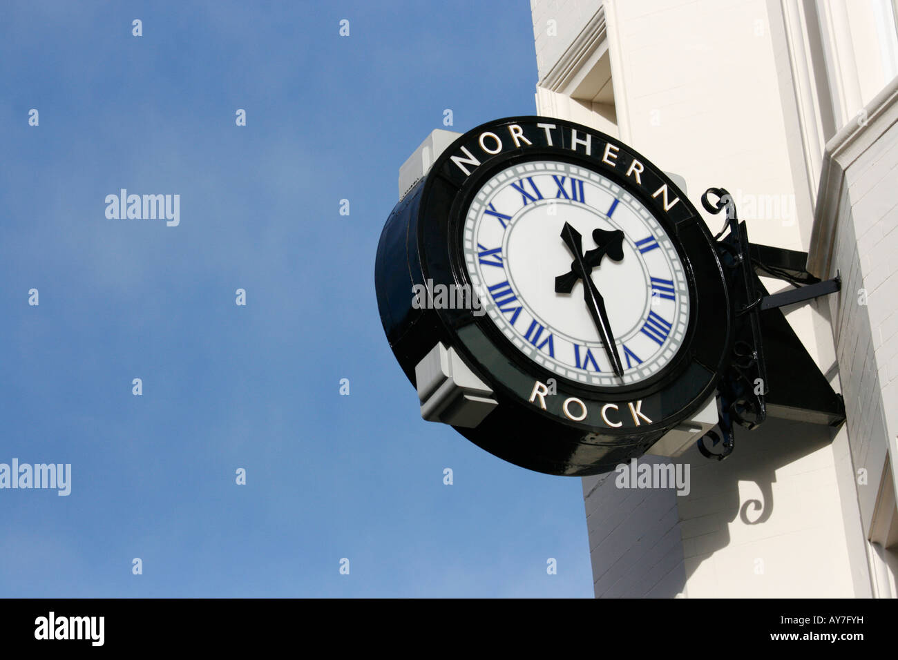 Clock bearing the name of Northern Rock above a branch of the building society (on Northumberland Street Newcastle. Stock Photo