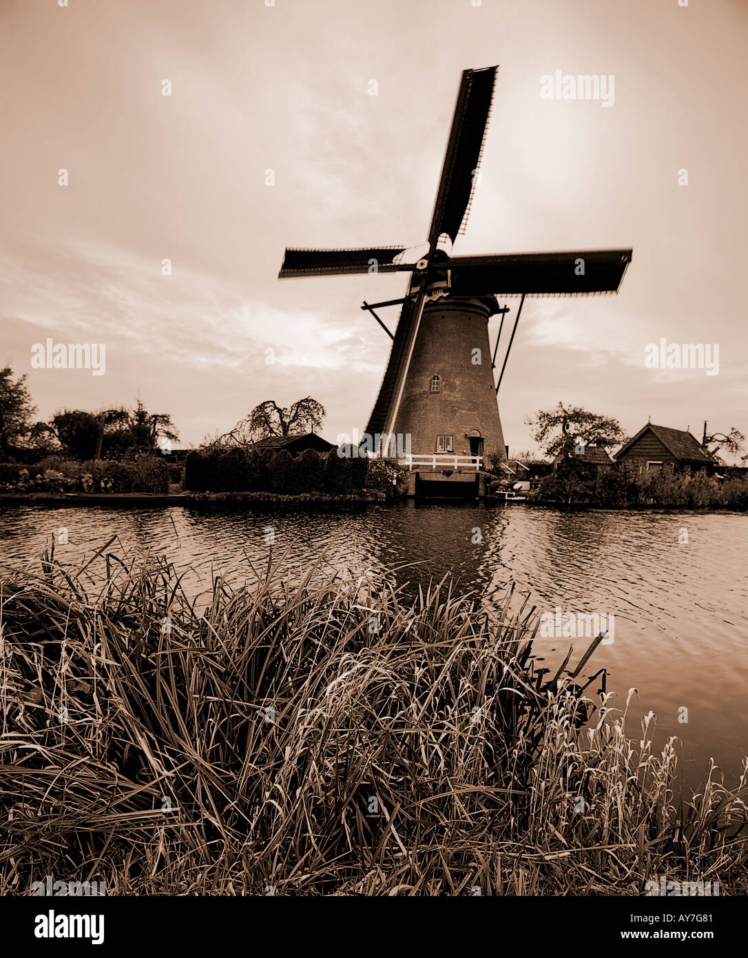 Windmill at Kinderdijk Holland Netherlands Europe with a Lith print effect Stock Photo