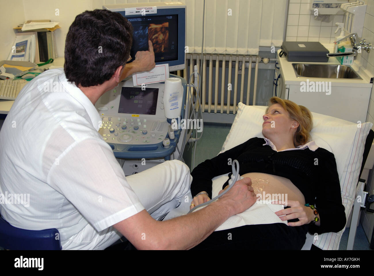 A woman undergoing a 3D ultrasound scan in the third month of pregnancy