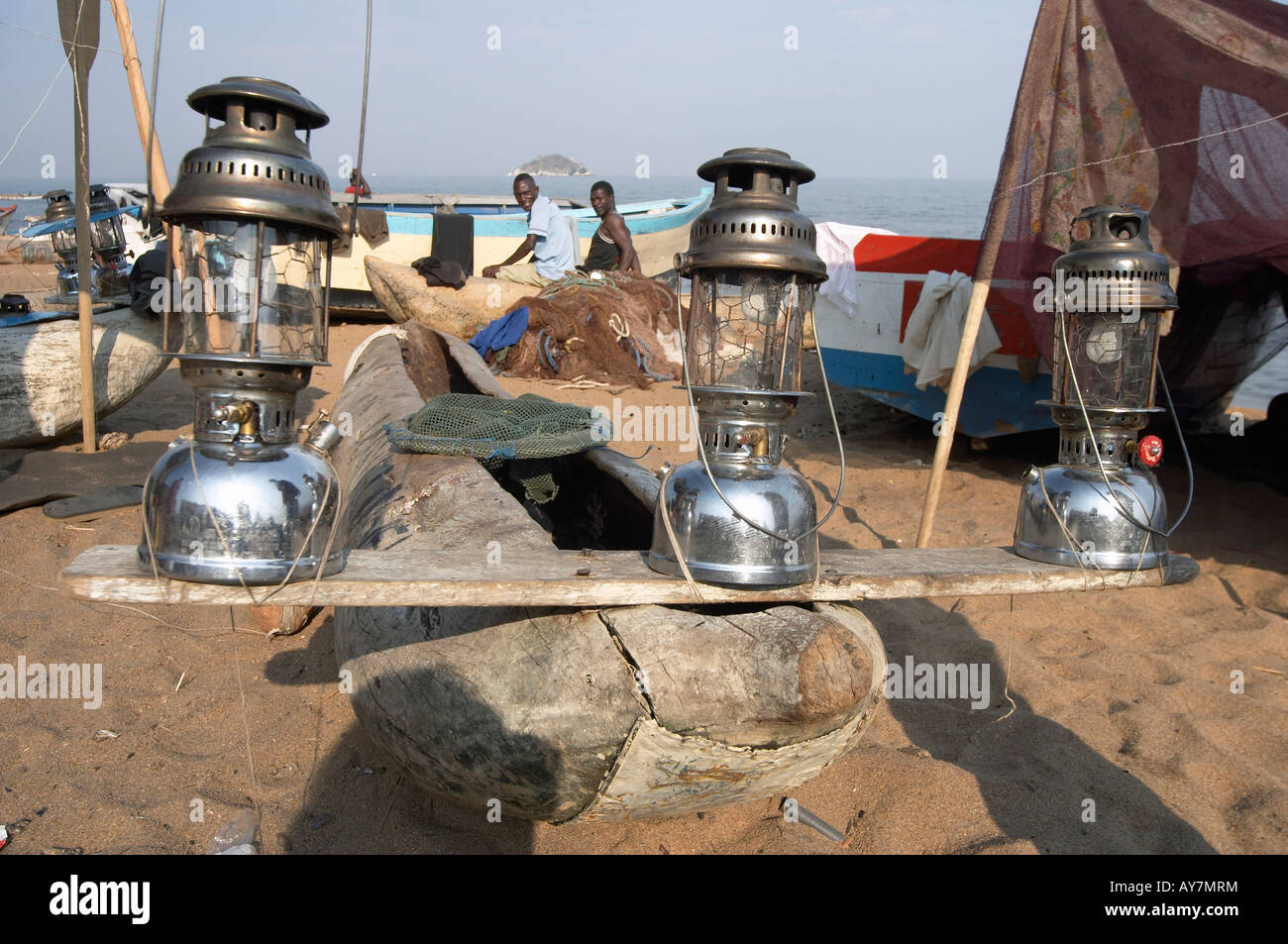 Paraffin lamps on dug-out fishing boat, Lake Malawi, Africa Stock Photo