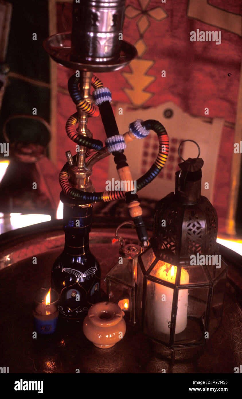 Traditional Moroccan hookah (water pipe) with lamps and candles Stock