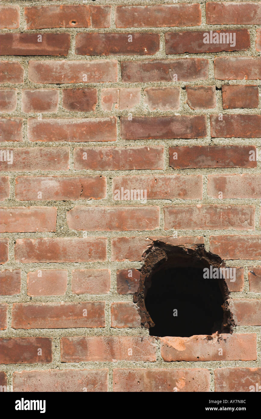 Holes in brick walls Stock Photo Alamy