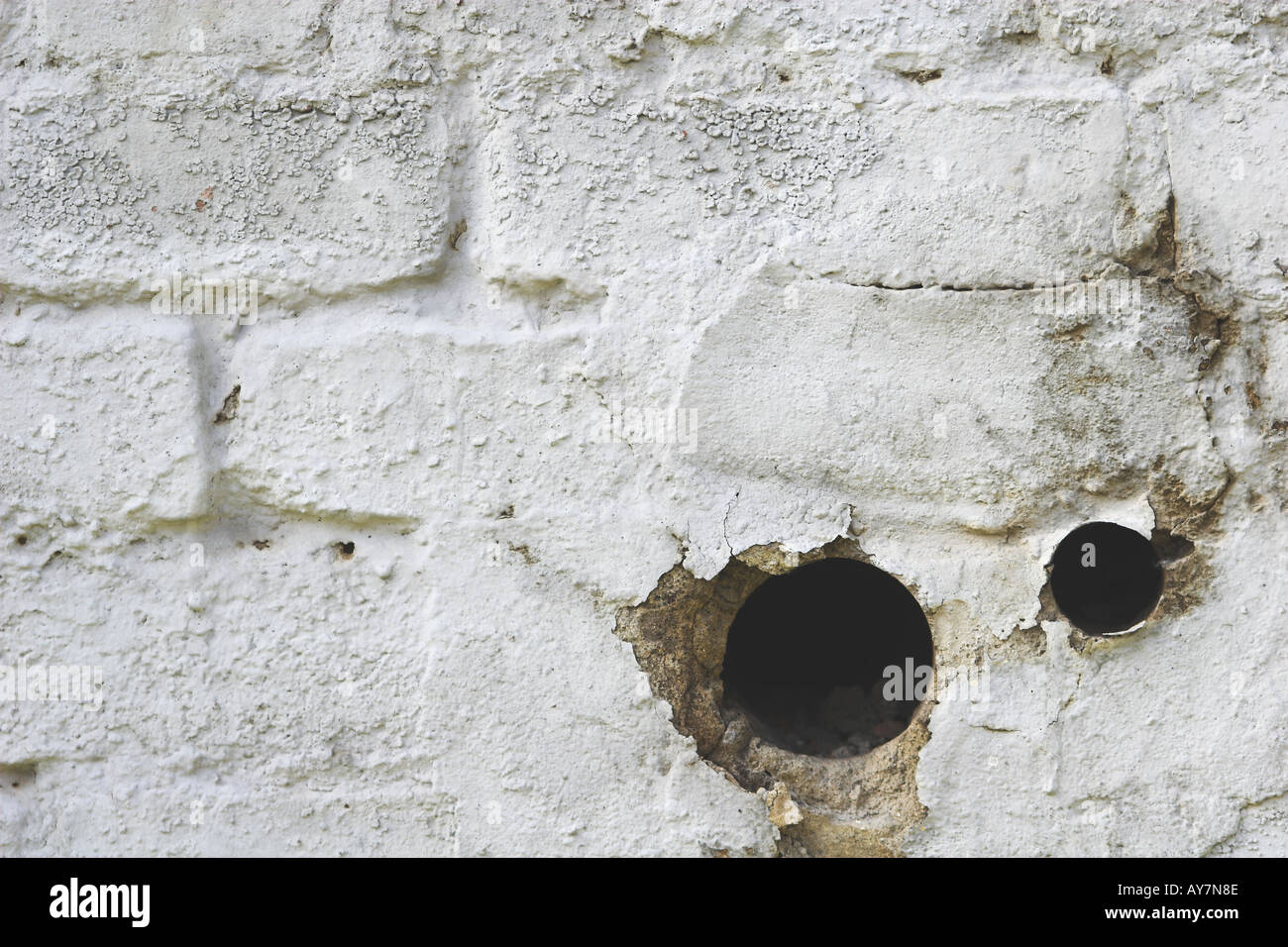 Holes in brick walls Stock Photo Alamy