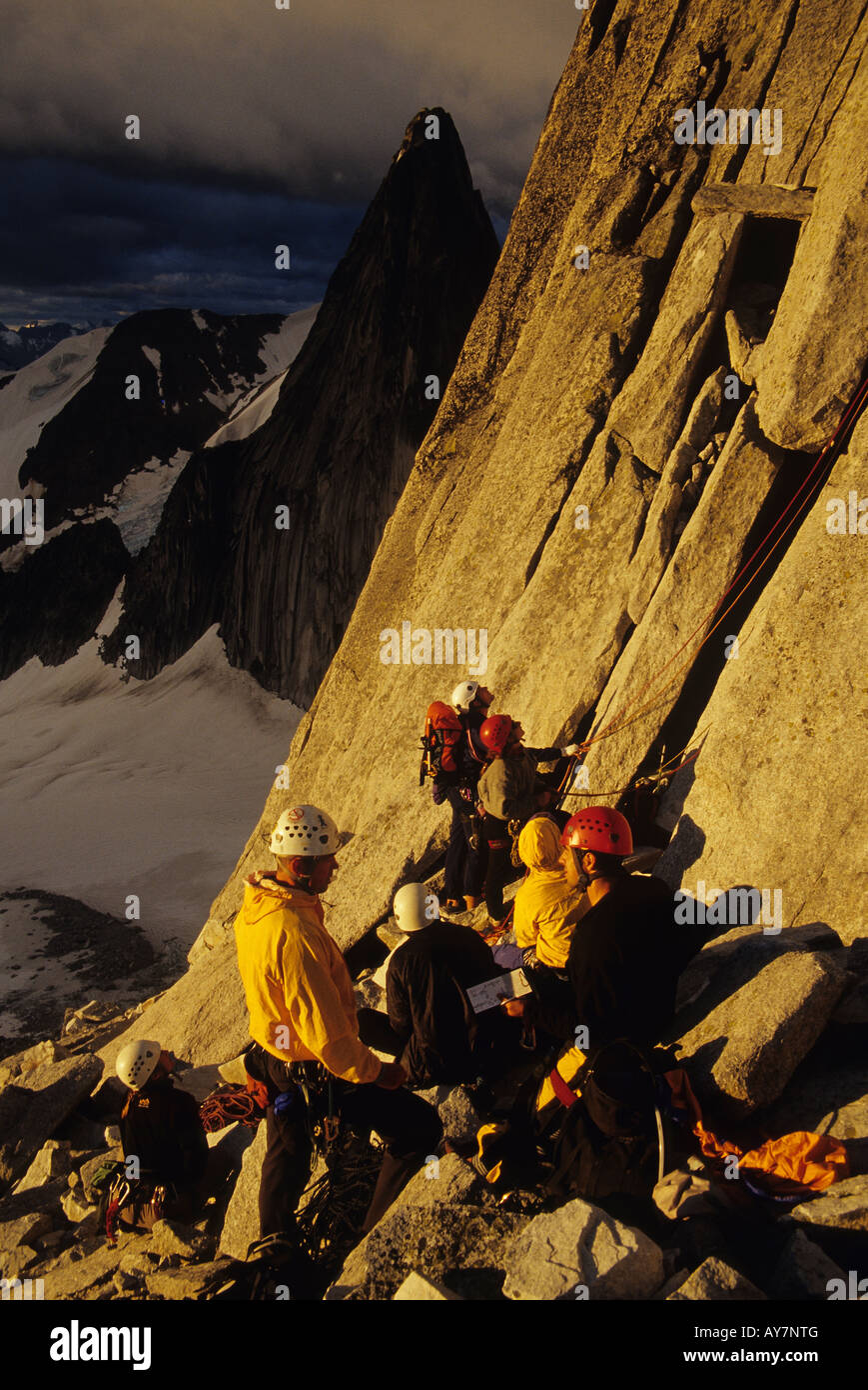 Climbers at the base of Bugaboo spire gearing up to climb the NE ridge Bugaboos Canada Stock Photo
