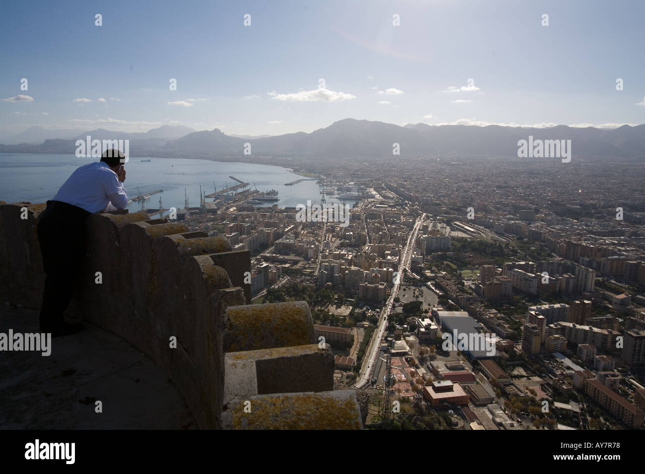 Man on the phone on the edge of Castello Utveggio Palermo Sicily Stock Photo
