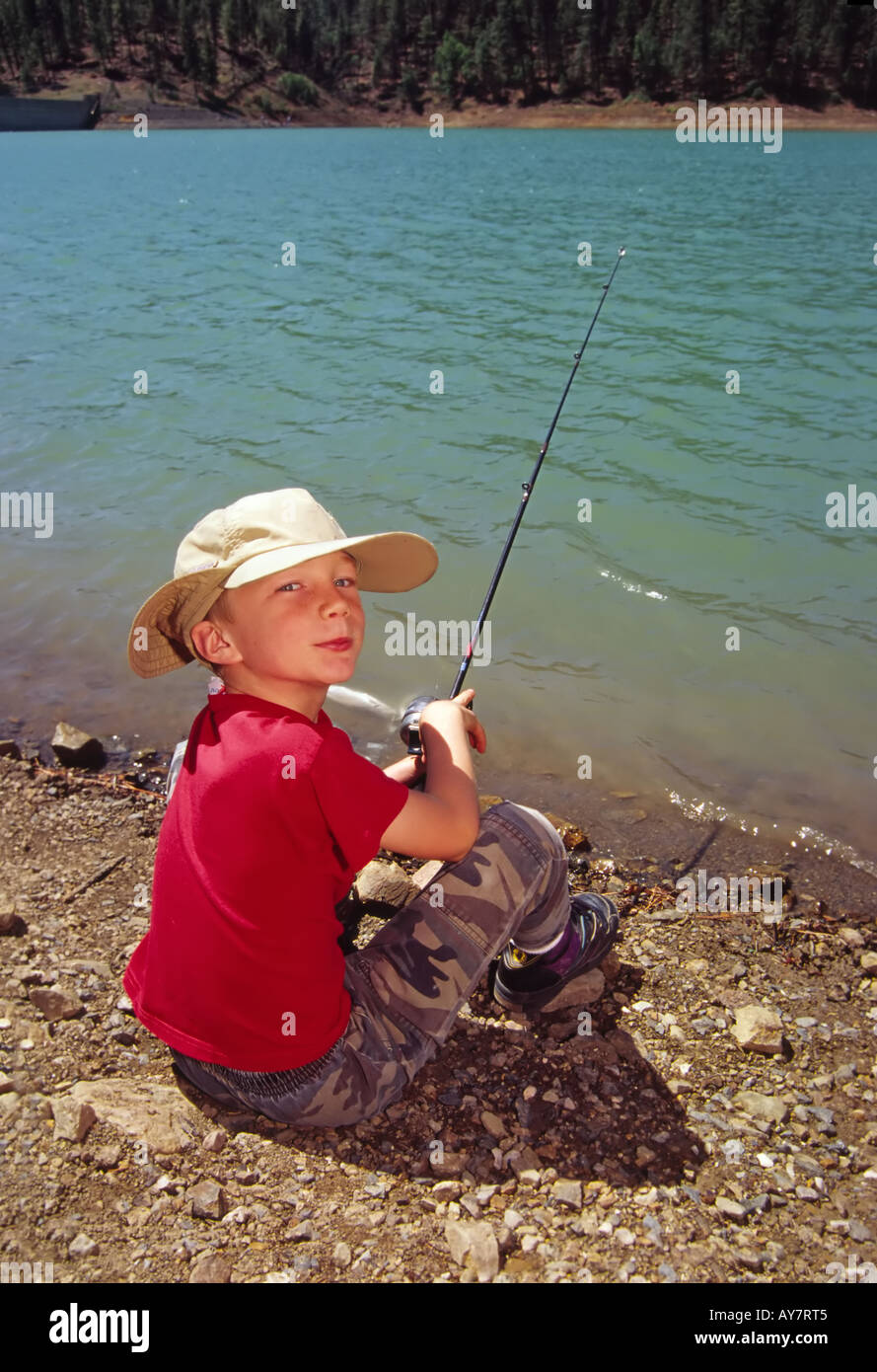 MR 504 Young angler Forrest Sweat lures in a lunker trout, during Fishing Day at  Grindstone Lake, in Ruidoso New Mexico. Stock Photo