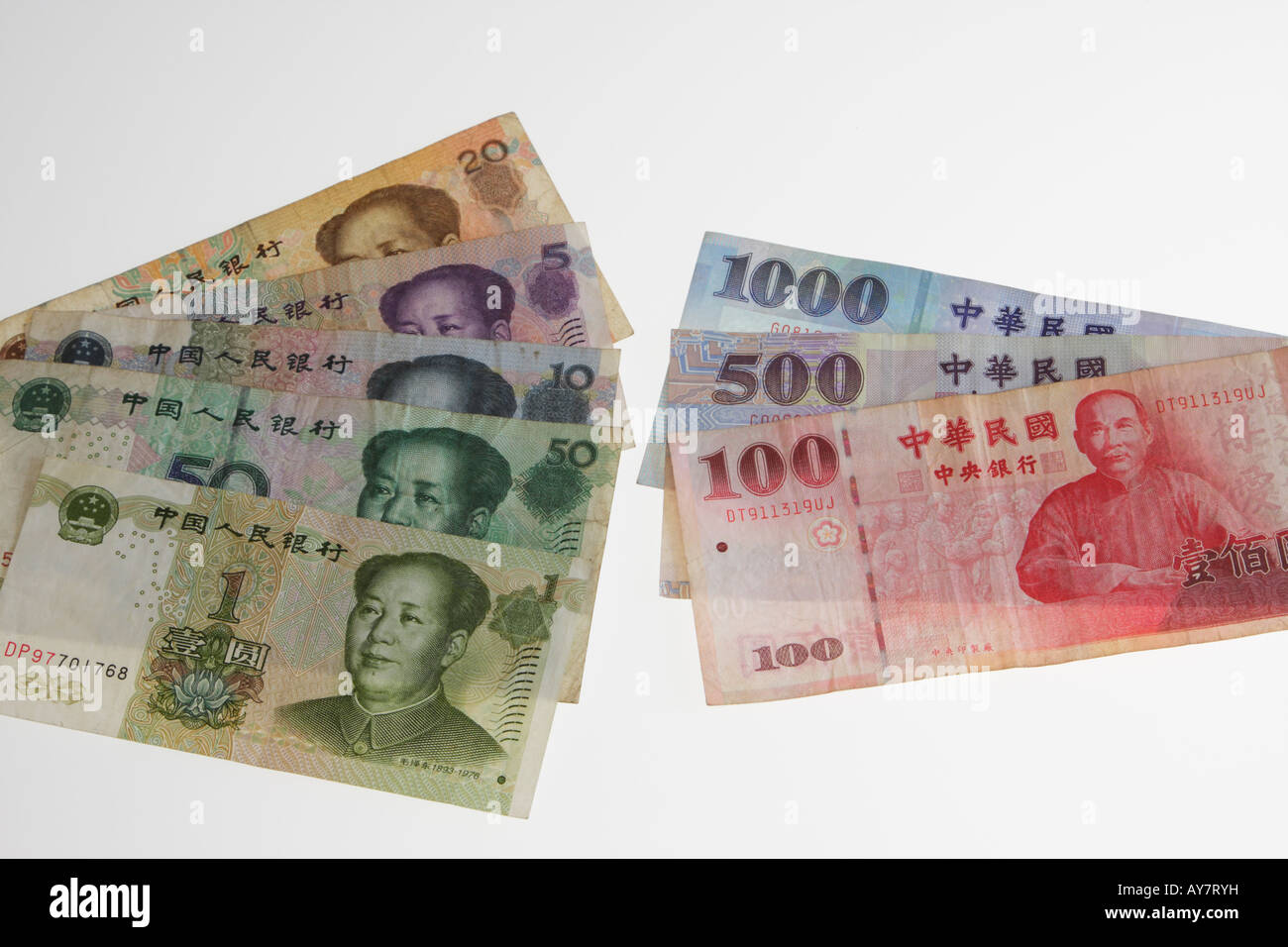 Chinese Ren Men Bi And Taiwan Dollar Notes On White Background In Studio Stock Photo